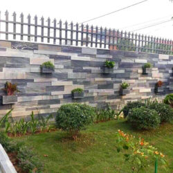 Thi công đá ghép ốp tường kết hợp chậu hoa